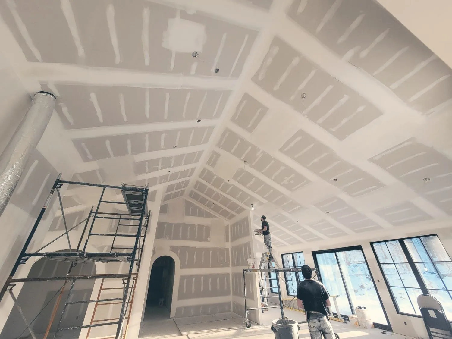 Vaulted ceiling drywall installation and taping by Chipper's Taping & Construction in Hamilton
